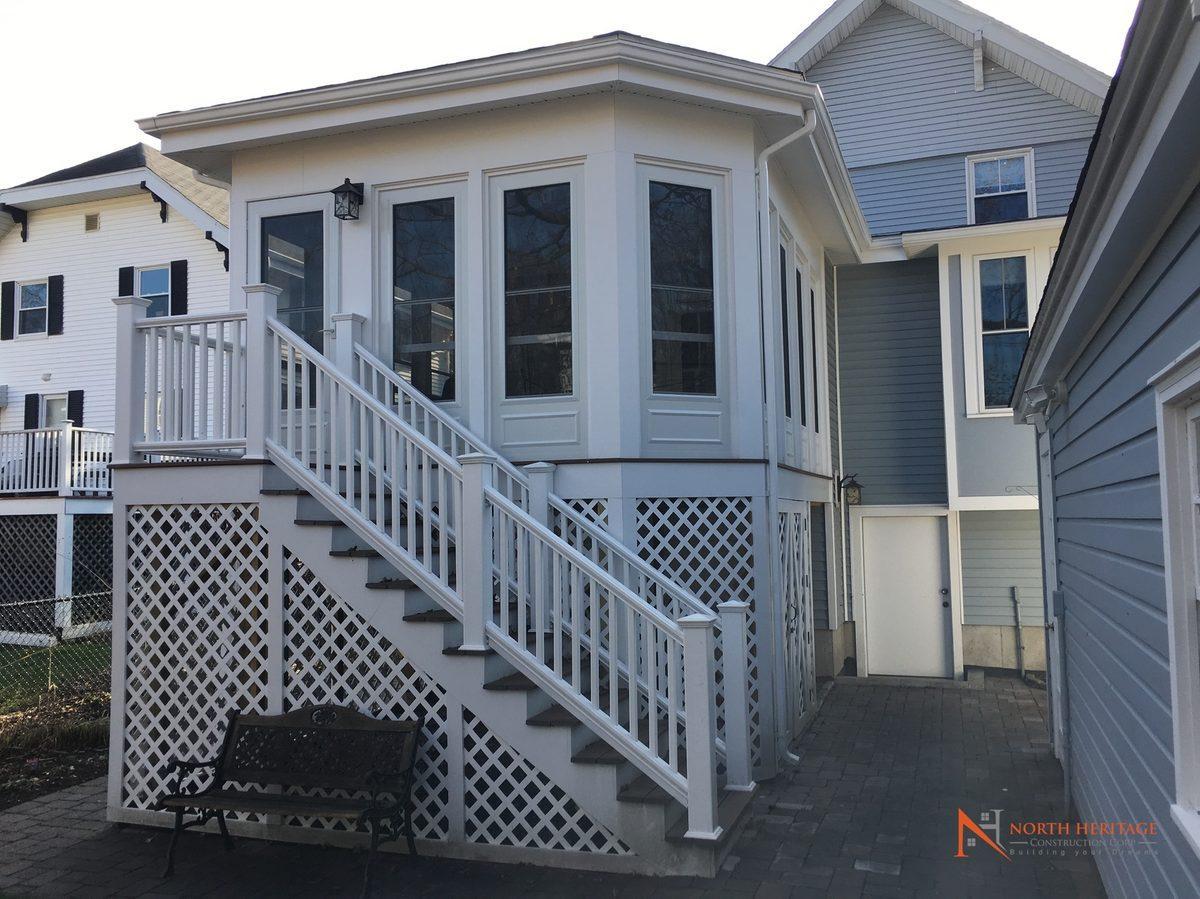Completed two-story home addition in Newton MA by North Heritage Construction