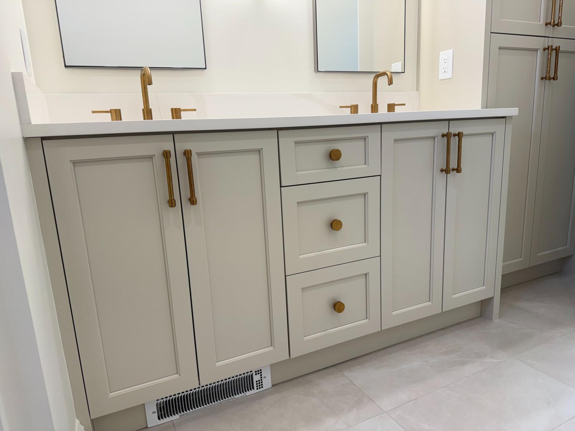 Master bath double vanity with shaker cabinets, quartz countertop and gold hardware