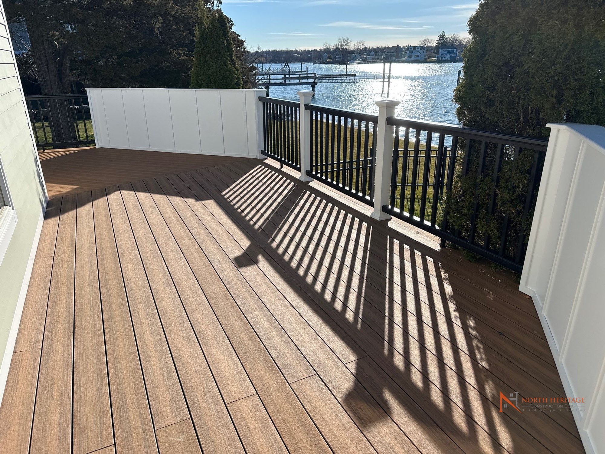 Deck after replacement - Deckorators composite decking with aluminum railings