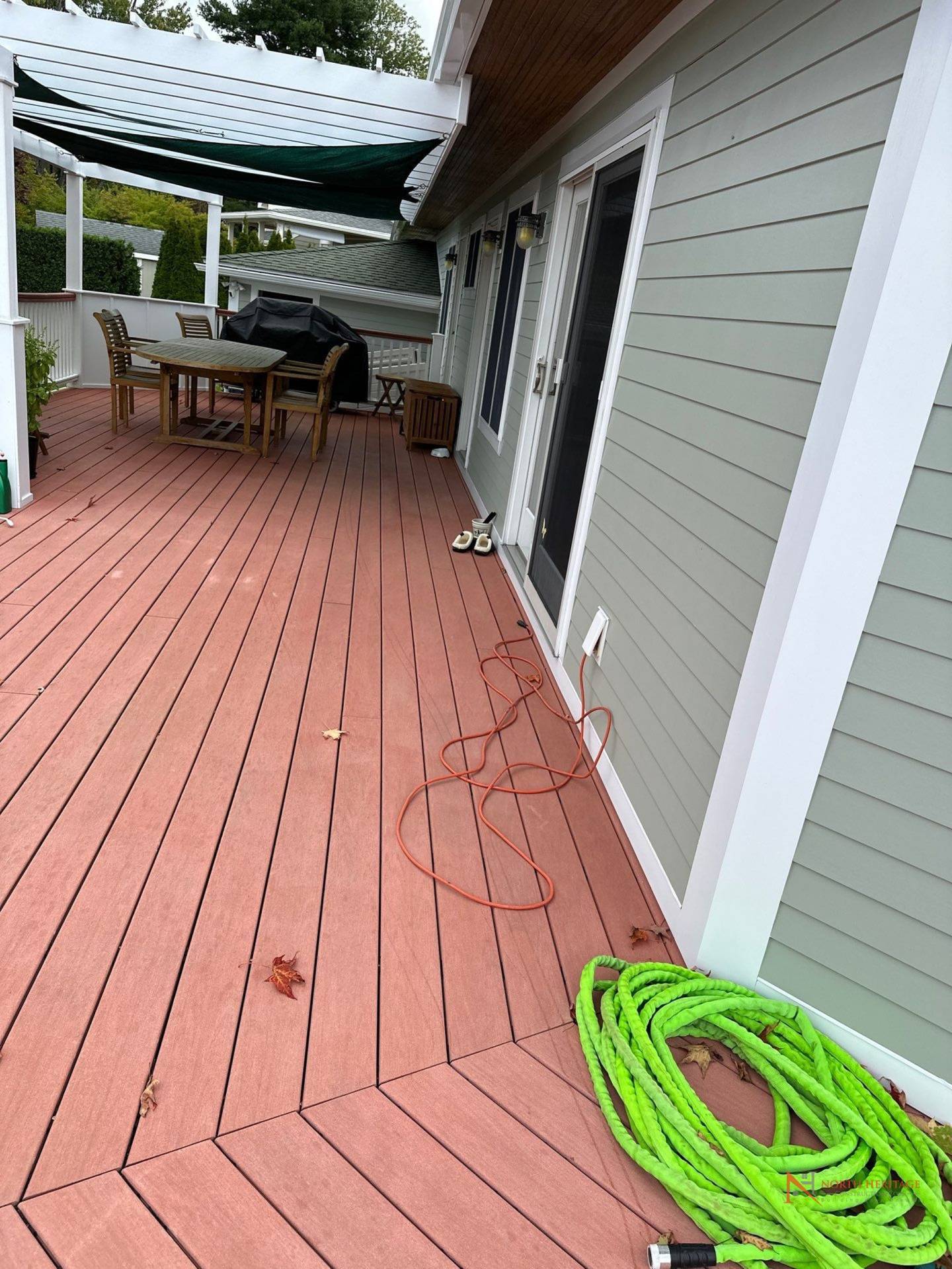 Deck before full replacement - deteriorating wood decking and railings