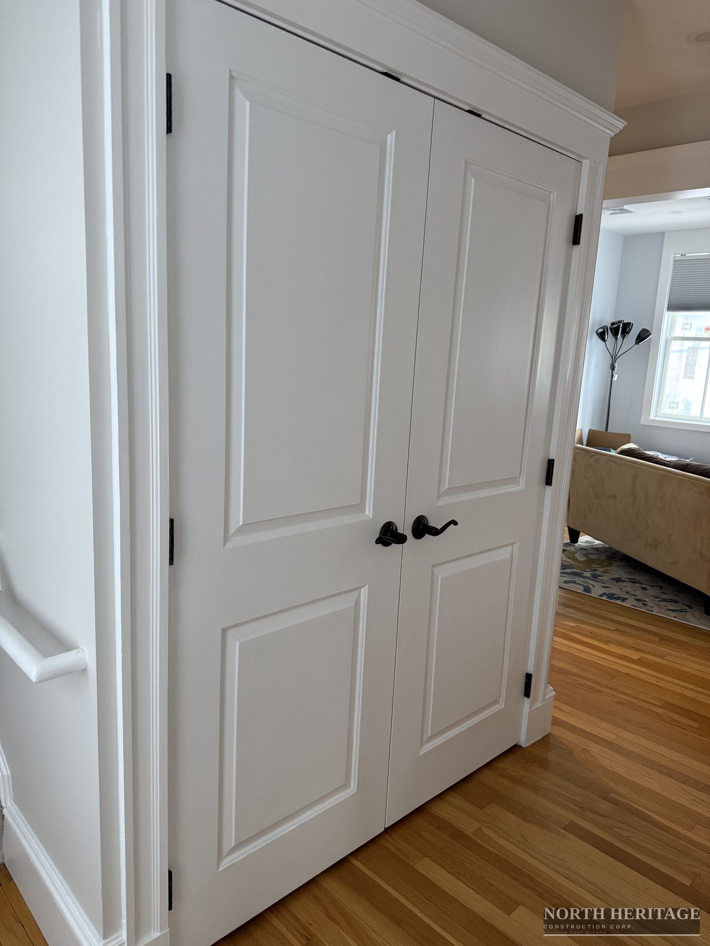 Custom interior French doors with crown molding trim Somerville home addition