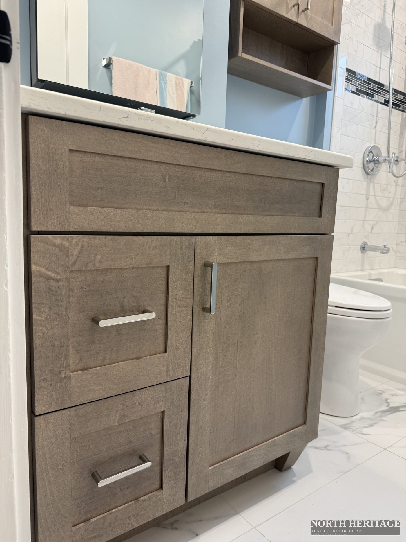 Custom bathroom vanity with quartz countertop and shaker cabinet doors