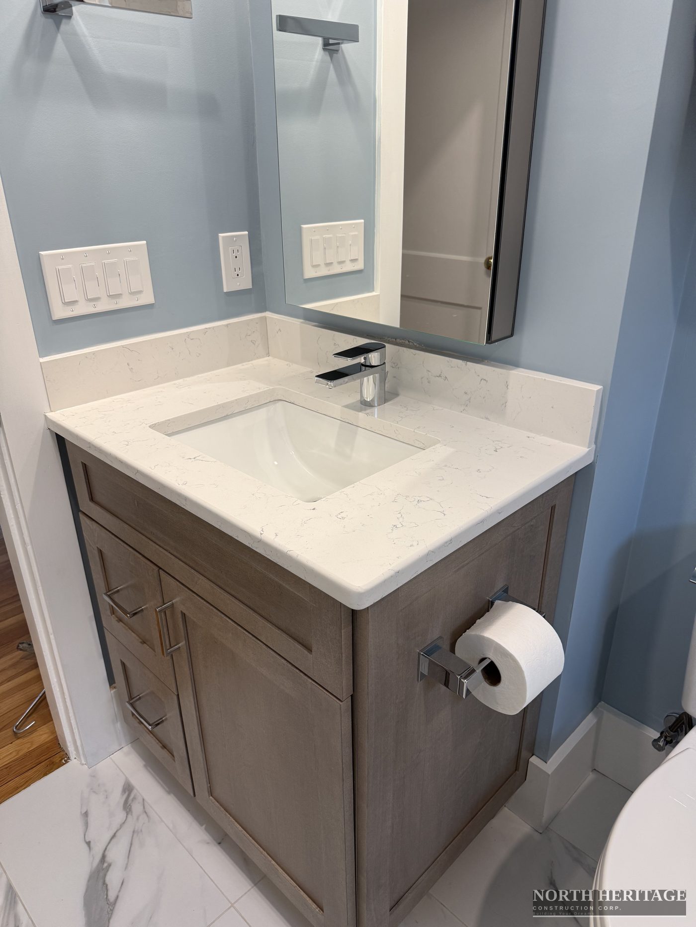 Quartz countertop bathroom vanity with undermount sink Somerville renovation